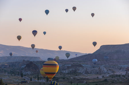 GOREME, TURKEY - JUNE 23, 2015: The great tourist attraction of Cappadocia - balloon flight. Cappadocia is known around the world as one of the best places to fly with hot air balloons. Goreme, Turkeyのeditorial素材