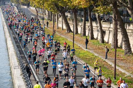 PARIS, FRANCE - OCTOBER 11, 2015: People running marathon in historical center of Paris, Franceのeditorial素材