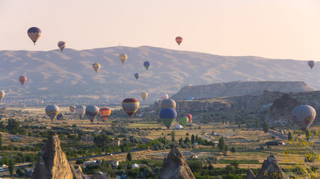 GOREME, TURKEY - JUNE 23, 2015: The great tourist attraction of Cappadocia - balloon flight. Cappadocia is known around the world as one of the best places to fly with hot air balloons. Goreme, Turkeyのeditorial素材