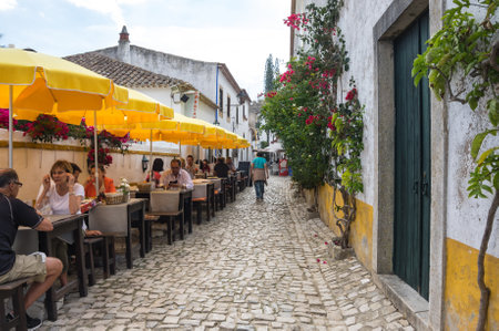 OBIDOS, PORTUGAL - OCTOBER 15, 2015: The street of Obidos in Portugal, popular tourist destination because of its a well-preserved medieval architectureのeditorial素材