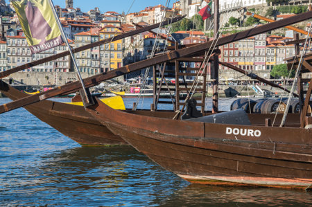 PORTO, PORTUGAL - OCTOBER 20, 2015: Typical wine boats in the Douro river in the historical center of Porto, the second largest city in Portugal after Lisbonのeditorial素材