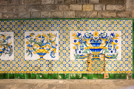 Ceramic tile on the wall of old house in gothic quarter of Barcelona, Spainの写真素材