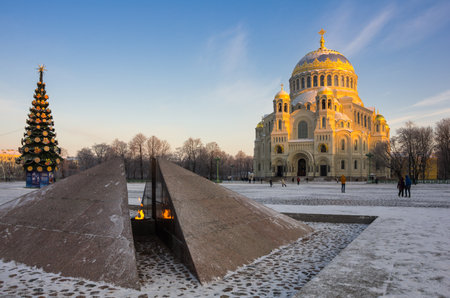Revolutionary memorial - quenchless flame at Yakornaya square and Orthodox Naval cathedral of Saint Nicholas in Kronshtadt, Saint Petersburg, Russiaのeditorial素材