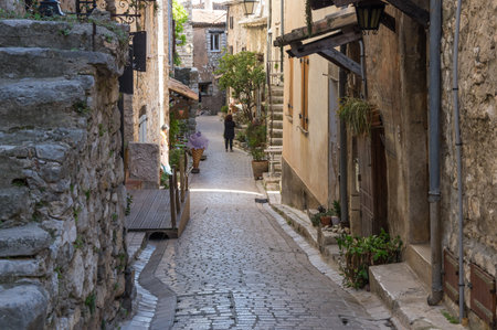TOURRETTES-SUR-LOUP, FRANCE - APRIL 25, 2016: Street of Tourrettes-sur-Loup, a medieval village in the Alpes-Maritimes department in southeastern Franceのeditorial素材
