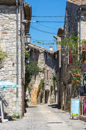 AIGUEZE, FRANCE - APRIL 28, 2016: The street of the village of Aigueze, a small village located south of France in the department of Gard of the french region Languedoc-Roussillon.のeditorial素材