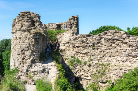 LENINGRAD REGION, RUSSIA - JUNE 04, 2016: Tourists visiting ruins of Koporye fortress in Leningrad region near Saint-Petersburg, Russiaのeditorial素材