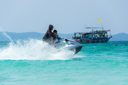 PATTAYA, THAILAND - FEBRUARY 02, 2017: Tourists skiing on water scooter on the beach of Ko Lan island in the Gulf of Thailand near Pattaya, Thailandのeditorial素材
