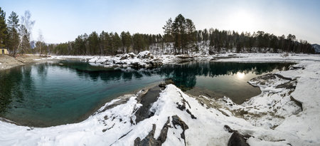 View of nonfreezing winter lake in Altay, Siberia, Russia