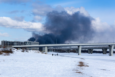 View of the fire over houses in Saint-Petersburg, Russiaの写真素材