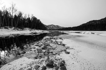 View of nonfreezing winter lake in Altay, Siberia, Russia