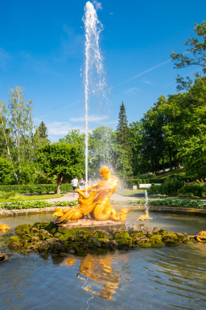 SAINT- PETERSBURG, RUSSIA - JUNE 18, 2018: The Triton fountain in the Lower Garden of Peterhof, Saint-Petersburg, Russia. The park ensemble of Peterhof belongs to the world heritage of UNESCOのeditorial素材