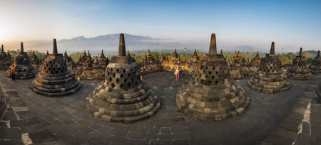 JAVA, INDONESIA - 09 SEPTEMBER 2018: Tourists watching sunrise at Borobudur, a 9th-century Mahayana Buddhist temple in Central Java, Indonesiaのeditorial素材