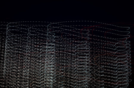 Abstract pattern of city lights from cars, windows, streetlights and barsの写真素材