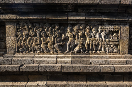 Bas-relief statue at Borobudur, a 9th-century Mahayana Buddhist temple in Central Java, Indonesia. It is the world's largest Buddhist temple.のeditorial素材