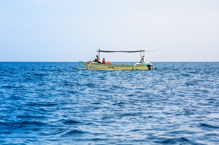 BALI, INDONESIA - 16 SEPTEMBER 2018: Tourists looking for dolphins from boats at Lovina beach of Bali, Indonesia. Popular activities for visitors include early-morning boat trips to see dolphinsのeditorial素材