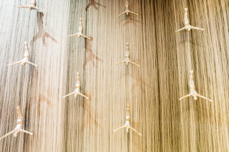 DUBAI, UNITED ARAB EMIRATES - 03 DECEMBER, 2018: Giant fountain with flying sculpture of an diver in Dubai Mall, Dubai, United Arab Emiratesのeditorial素材