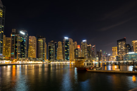 DUBAI, UNITED ARAB EMIRATES - 05 DECEMBER, 2018: Night view on skyscrapers of Dubai Marina, an artificial canal city in Dubai, United Arab Emiratesのeditorial素材