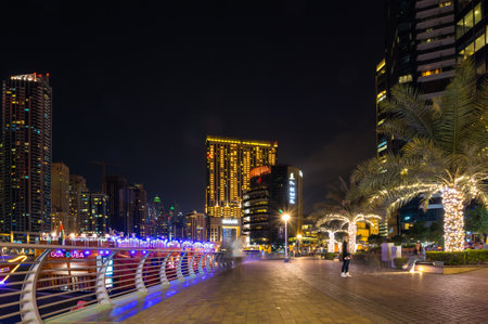 DUBAI, UNITED ARAB EMIRATES - 05 DECEMBER, 2018: Night view on skyscrapers of Dubai Marina, an artificial canal city in Dubai, United Arab Emiratesのeditorial素材