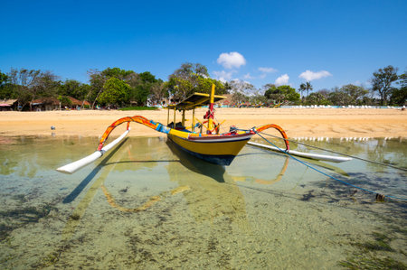 The coast of Indian ocean on resort Sanur of island Bali, Indonesiaの写真素材
