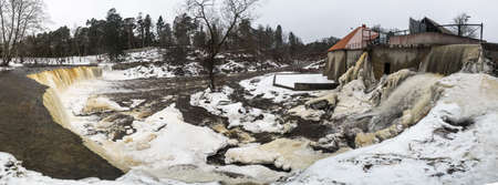 Partly frozen Keila-Joa waterfall in winter near Tallinn, Estoniaの写真素材