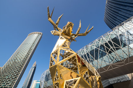 DUBAI, UNITED ARAB EMIRATES - 09 DECEMBER, 2018: View of golden deer and modern skyscrapers in the center of Dubai, United Arab Emiratesのeditorial素材