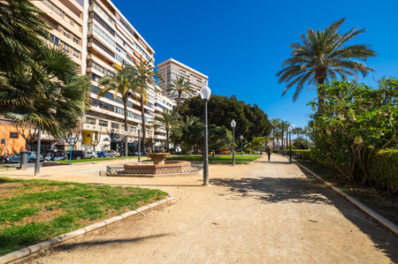 ALICANTE, SPAIN - 09 APRIL, 2019: View of alley of palm trees, the main tourist street in Alicante, Spainのeditorial素材