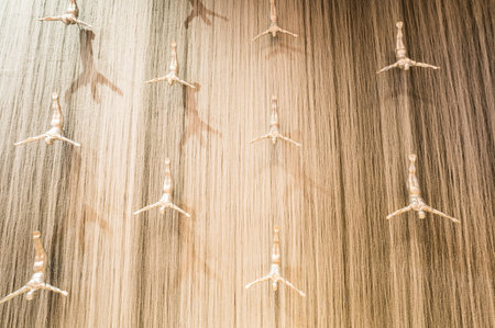 DUBAI, UNITED ARAB EMIRATES - 03 DECEMBER, 2018: Giant fountain with flying sculpture of an diver in Dubai Mall, Dubai, United Arab Emiratesのeditorial素材