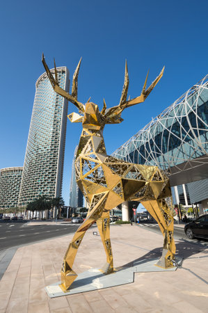 DUBAI, UNITED ARAB EMIRATES - 09 DECEMBER, 2018: View of golden deer and modern skyscrapers in the center of Dubai, United Arab Emiratesのeditorial素材