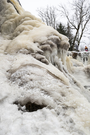 TALLINN, ESTONIA - 23 FEBRUARY, 2019: Partly frozen Keila-Joa waterfall in winter near Tallinn, Estoniaのeditorial素材