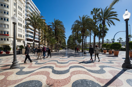 ALICANTE, SPAIN - 09 APRIL, 2019: View of alley of palm trees, the main tourist street in Alicante, Spainのeditorial素材