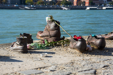 Shoes on the bank of the Danube River in Budapest - Memorial in honor of the Jews who were executed by the river Danube in Budapest by Hungarian Nazis during the World War IIのeditorial素材