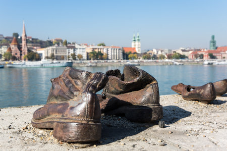 Shoes on the bank of the Danube River in Budapest - Memorial in honor of the Jews who were executed by the river Danube in Budapest by Hungarian Nazis during the World War IIのeditorial素材