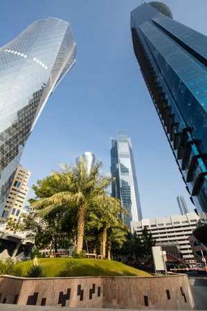 Panoramic view with modern skyscrapers in the center of Doha, the capital and most populous city of...