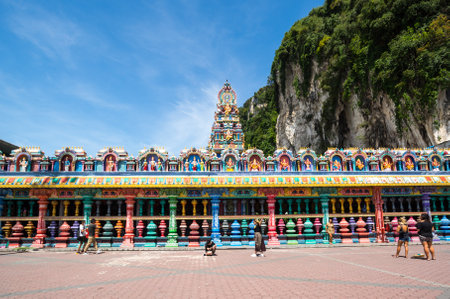 GOMBAK, MALAYSIA - FEBRUARY 03, 2020: Detail of brightly colored architecture surrounding the entrance to Temple Cave, part of the Batu Caves site at Gombok, Malaysiaのeditorial素材