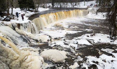 TALLINN, ESTONIA - 23 FEBRUARY, 2019: Partly frozen Keila-Joa waterfall in winter near Tallinn, Estoniaのeditorial素材