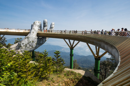 BA NA HILLS, VIETNAM - FEBRUARY 14, 2020: Golden Bridge in Ba Na Hills, a resort located in the Truong Son Mountains west of the city of Da Nang, in central Vietnamのeditorial素材