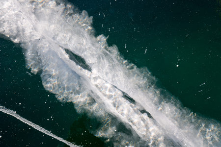 Ice of Lake Baikal, the deepest and largest freshwater lake by volume in the world, located in...