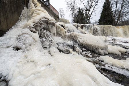 Partly frozen Keila-Joa waterfall in winter near Tallinn, Estoniaの写真素材