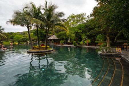 NHA TRANG, VIETNAM - 12 FEBRUARY, 2020: Big swimming pool in hotel of Nha Trang, coastal city and capital of Khanh Hoa Province, on the South Central Coast of Vietnamのeditorial素材