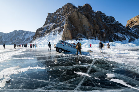 BAIKAL, RUSSIA - FEBRUARY 15, 2021: View of a car falling into a crack at Baikal lake, Siberia, Russiaのeditorial素材