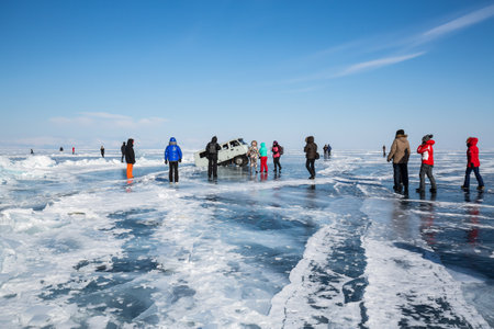 BAIKAL, RUSSIA - FEBRUARY 15, 2021: View of a car falling into a crack at Baikal lake, Siberia, Russiaのeditorial素材
