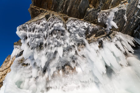 Icicles on the rocks on Olkhon island, Baikal lake, Siberia, Russia