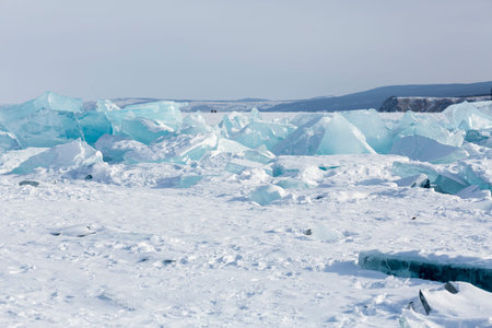 Coast of lake Baikal in winter, the deepest and largest freshwater lake by volume in the world,...