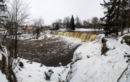 Partly frozen Keila-Joa waterfall in winter near Tallinn, Estoniaの写真素材