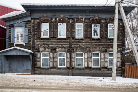 IRKUTSK, RUSSIA - FEBRUARY 20, 2021: Street with typical Russian log houses located in the historical center of Irkutsk, Siberia, Russiaのeditorial素材