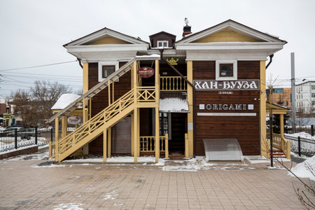 IRKUTSK, RUSSIA - FEBRUARY 20, 2021: Street with typical Russian log houses located in the historical center of Irkutsk, Siberia, Russiaのeditorial素材
