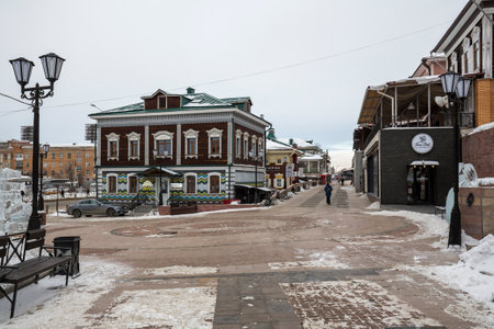 IRKUTSK, RUSSIA - 20 FEBRUARY, 2021: Street with typical Russian log houses located in the historical center of Irkutsk, Siberia, Russiaのeditorial素材