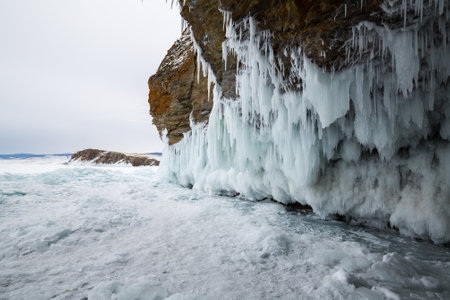Coast of lake Baikal in winter, the deepest and largest freshwater lake by volume in the world, located in southern Siberia, Russiaの写真素材