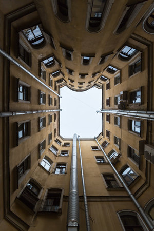 Courtyard well in old residential house in the historical center of Saint-Petersburg, Russiaの写真素材