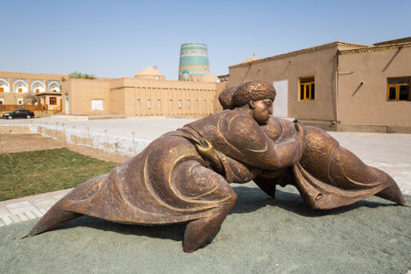 Modern sculpture of Kurash wrestlers at the square of Itchan-kala, old citadel of Khiva, Uzbekistanの写真素材